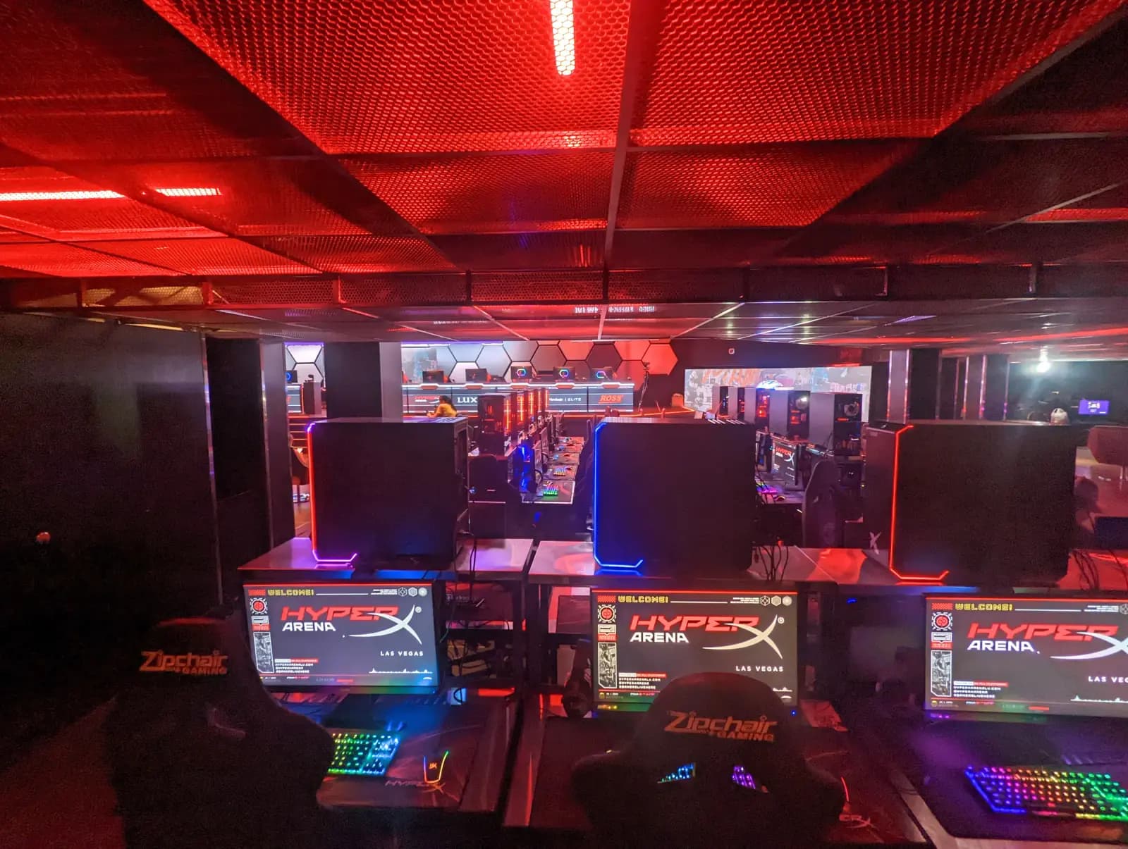Rows of gaming PCs under red lights at the HyperX Esports Arena in Las Vegas
