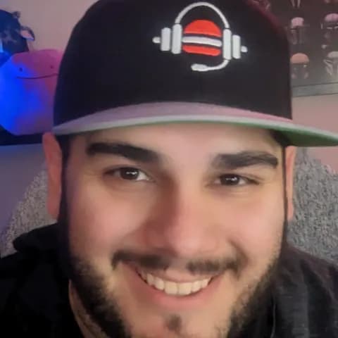 Pedro Zabala in a GameLiftEat cap, smiling in his stream room